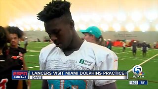 Lancers football team visits Dolphins 8/2