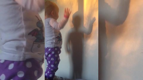 "A Tot Girl Discovers Her Own Shadow"