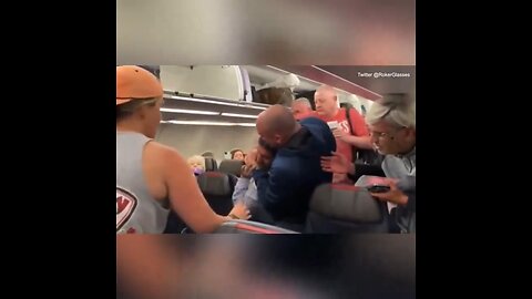 AA passenger gets put in a headlock and escorted off plane after yelling an anti-Semitic slur