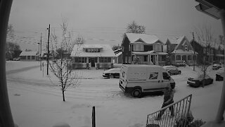 Mailman takes a quick break to make a snow angel