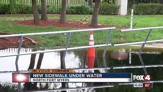 Submerged sidewalk leaves residents simmering