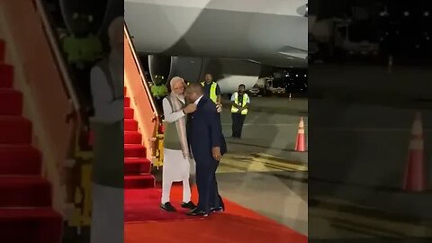 Papua New Guinea and the PM of that country touches modi's feet in respect.