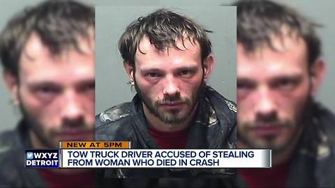 Tow driver arrested; bought car insurance, pizza with accident victim's bank card