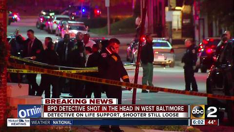 Police continue to search for gunman after Baltimore detective shot