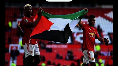 Paul Pogba holds Palestine flag with Manchester United team-mate Amad Diallo at Old Trafford