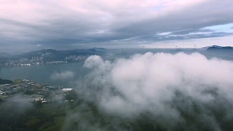 Drone in clouds with City view