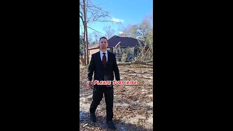 Dude in nice suit drops tree super close to house.