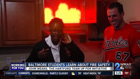 John Means helps students learn about fire safety