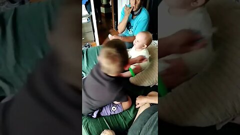 Cute Baby Talking To Dad And Brother