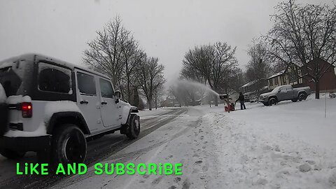 Snowblower Impeller Modification Kit Throwing Snow Over Street and a Jeep Wrangler