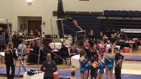 A Teen Gymnast Girl Bounces Off The Uneven Bars