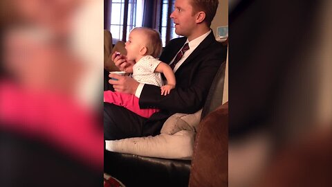 Baby is too Hungry to Wait for Dad to Bring the Spoon to Her