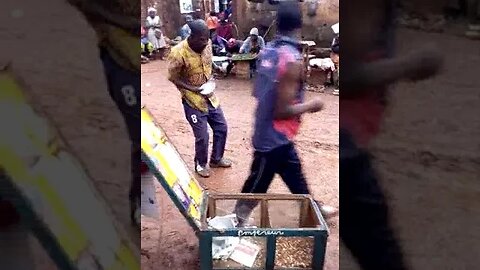 A Masterful Street Vendor of Artisanal Delights of Fried Peanuts and Corn