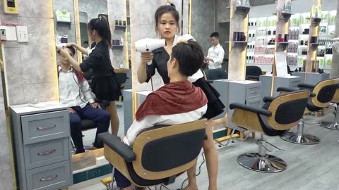 Beautiful girl in H2 barbershop, relaxing shampoo is a gift for stressful times