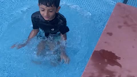 Cute boy in swimming pool in DUBAI