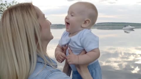 Cute baby laughing when he flying