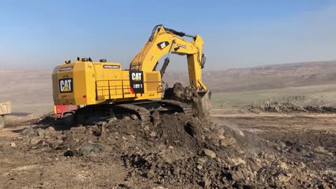 Caterpillar 6015B Excavator Loading Trucks With Two Passes - Sotiriadis Mining Works