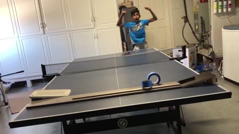 Ping Pong Trick Shot Through A Moving Duct Tape Roll