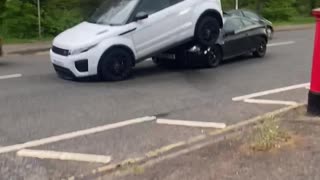 Car Stuck Under SUV