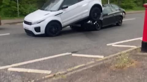 Car Stuck Under SUV