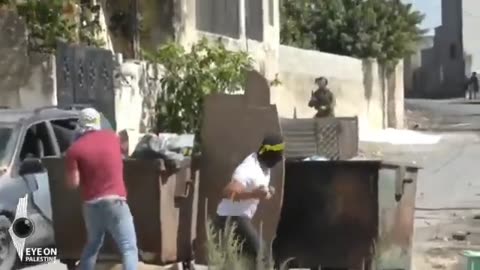 Palestinian youths shower Israeli forces with stones during an Israeli raid of Kufr Qaddoum.