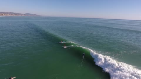 Terry surfs Doheny on a Kai wa'a Ares outrigger