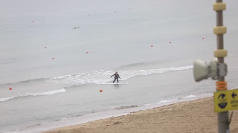 a woman who enjoys surfing