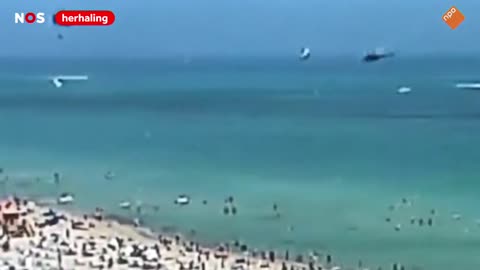 Helicopter Crashes Between People Swimming.