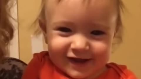 the child laughed out loud because of his mother's behavior