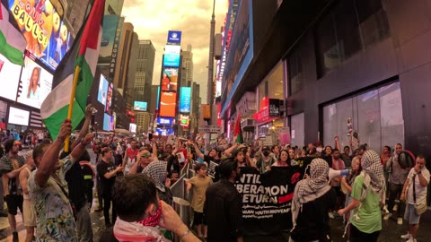 Times Square - 300 days of genocide. We stand with the martyrs, the prisoners, with Gaza!