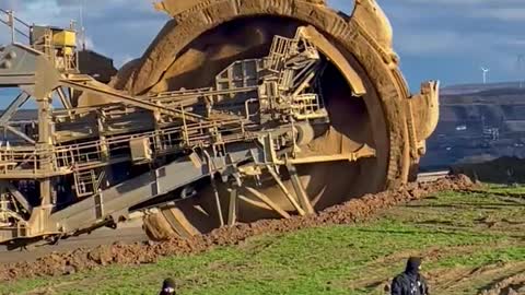 Activists rally to save German village from coal mine expansion, excavator comes to standstill