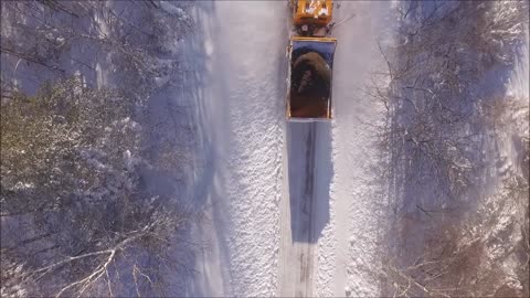 Snowplow Clears Deep Heavy Snow After Storm