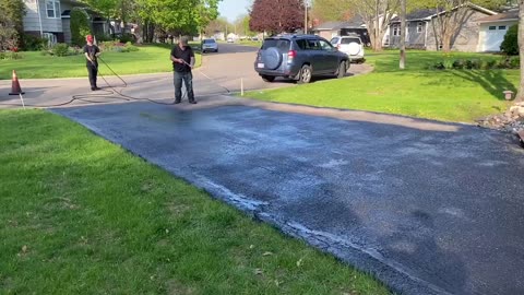 Professional Asphalt Spray Sealing: “The Cool Customer Sealed One” Top Coats Pavement Maintenance