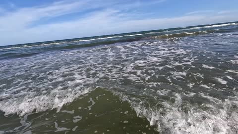 Surf fishing clear water in Galveston, Texas