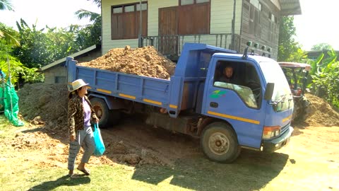 Tractor makes light work of soil.