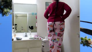 Woman With A Long Braid Wearing Pajamas