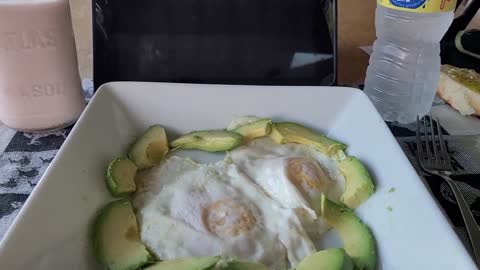 Making an avocado and egg sandwiches.