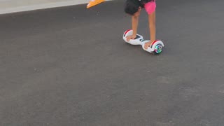 Handstand balance on hoverboard