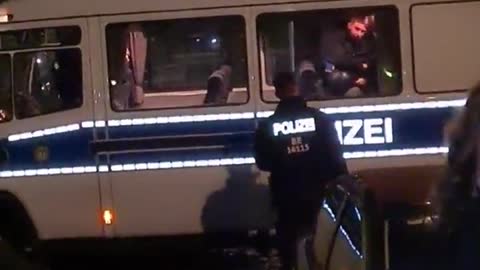 Berlin Germany - Police caught beating an arrested citizen in a Police Van