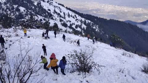 People enjoying snow.