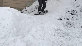 Guy orange jacket snow board small slope fall on face