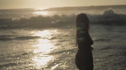 Beautiful Girl Dancing On Beach