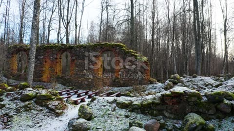 Abandoned church boulder wall remains with new seats