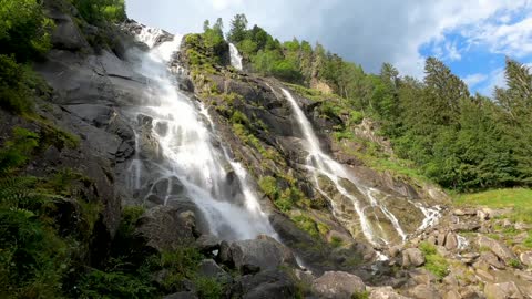 tall and beautiful waterfalls relaxing the sound of birds in the morning