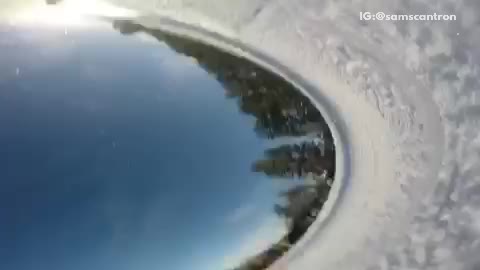 Gopro falls off snowboarders helmet and rolls down slope