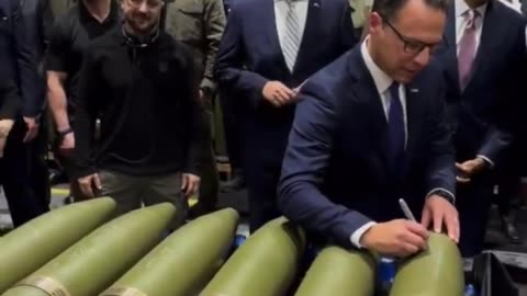 Ukraine politicians signing BOMBS to be dropped to kill civilians. SICK!