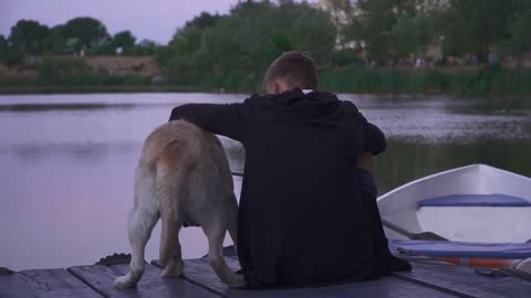 Young boy and dog outdoors