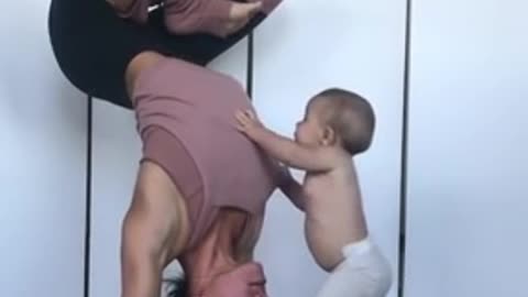 Baby wants to join mother's yoga session