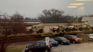 A Multitude of Military Vehicles Heading into Chicago