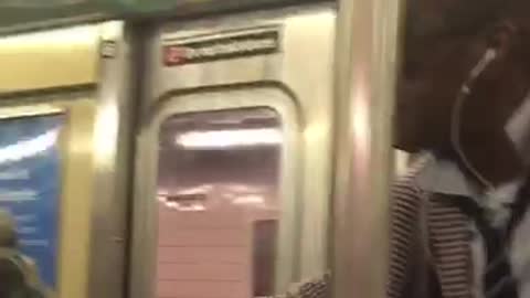 Two people singing on subway train